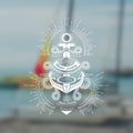 Anchor with rope nodes. Marine vintage label on blurred sea photo background Royalty Free Stock Photo